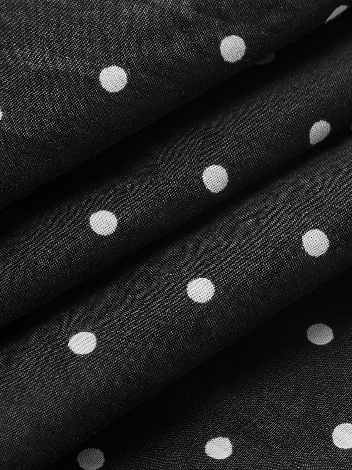 Robe courte à bretelles fines et dos noué à pois