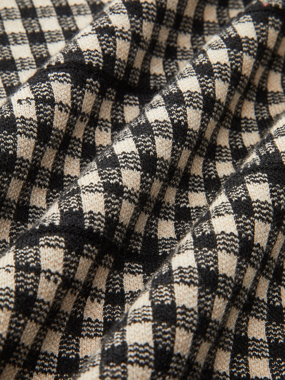 Robe pull à carreaux ceinturée