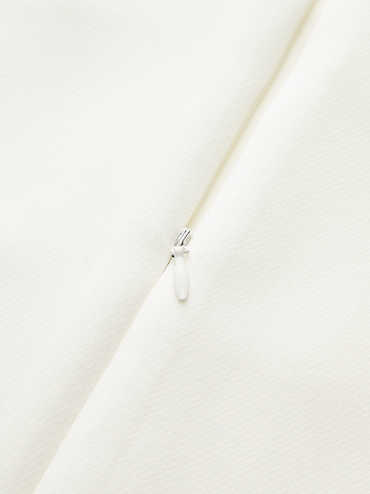 Haut péplum sans manches à fermeture éclair au dos