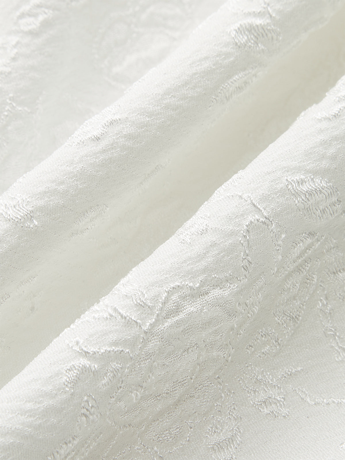 Haut péplum à boutons texturés