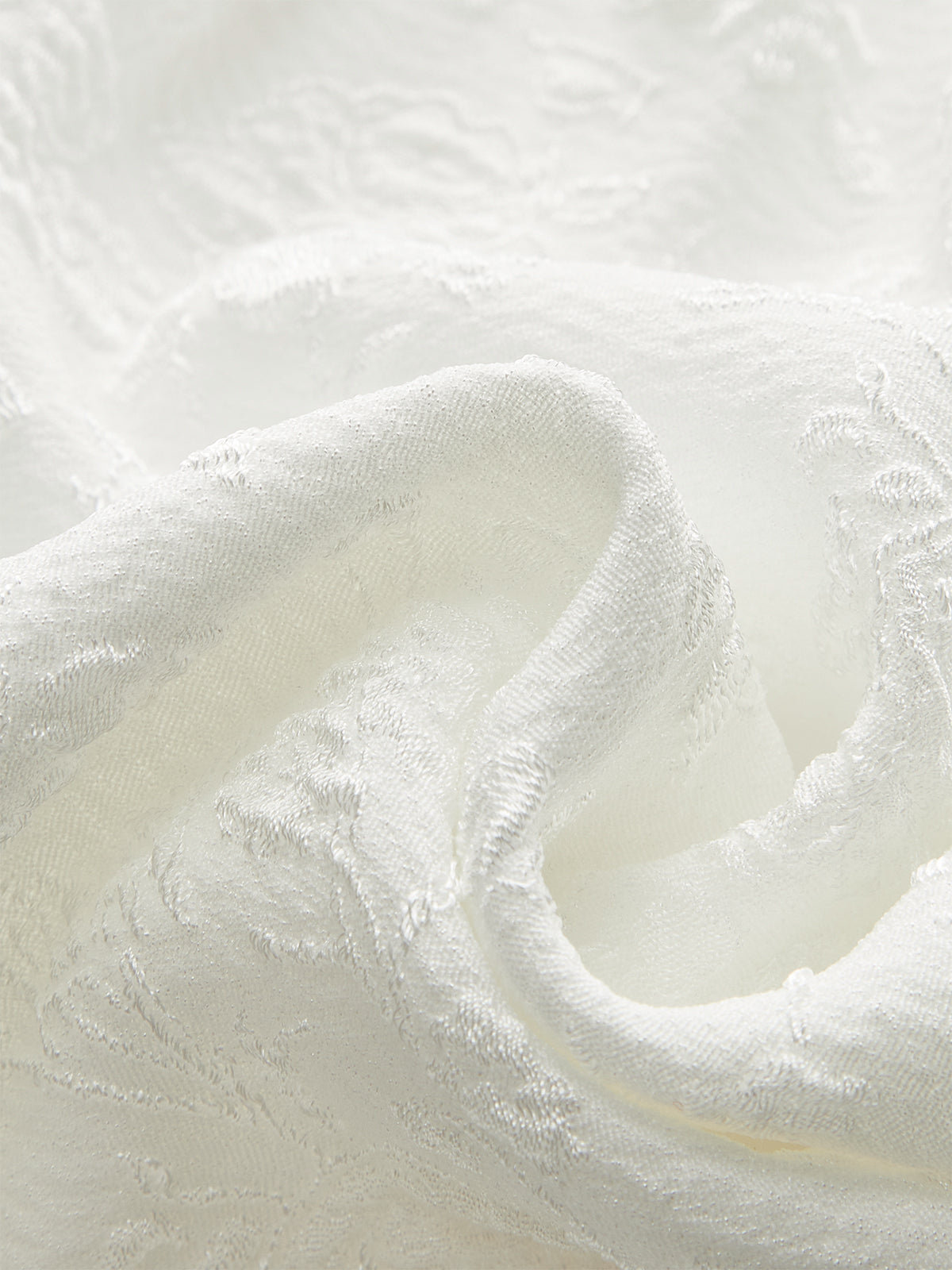 Haut péplum à boutons texturés