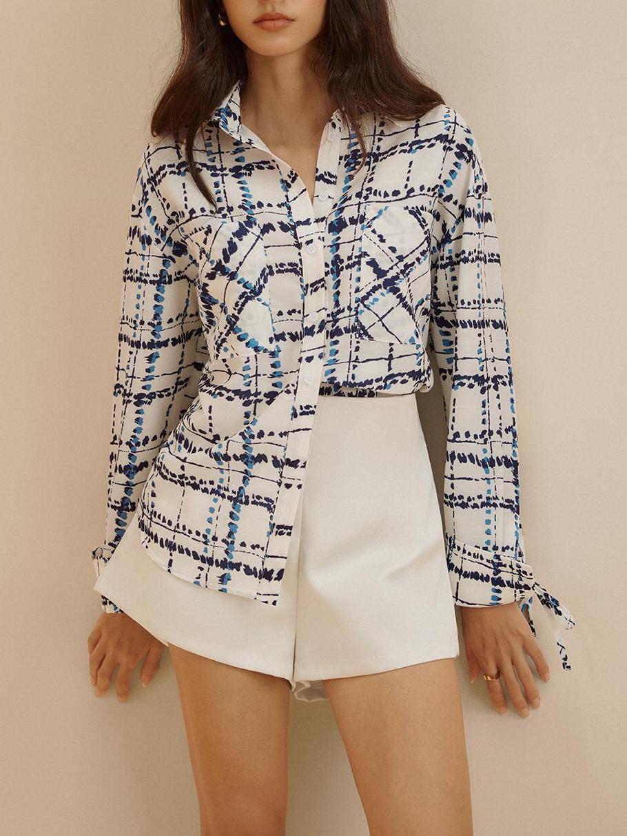 Chemise à carreaux à revers oversize et poches imprimées 